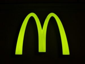 Mcdonald’s Golden Arches Logo Against Black Background