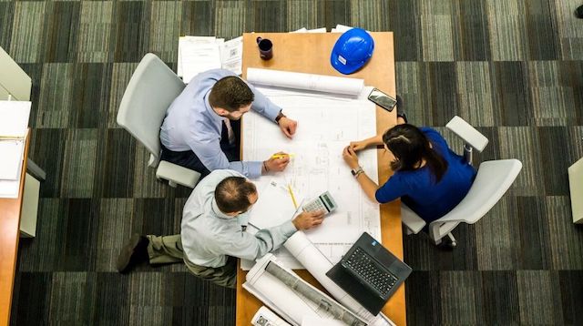 Overhead View of Three People Sitting at a Table