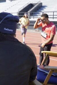 Andre De Grasse peers into the film booth