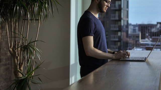 Business License Man Working at Counter