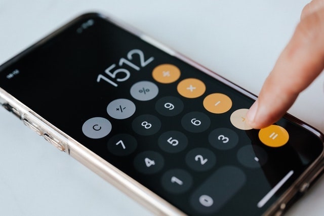 Closeup of a person using a calculator app