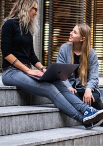 Management Consulting Two Women Chatting