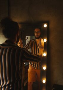 Networking Tips Man Looking at Himself in the Mirror