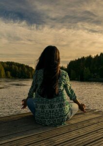 New Year Resolution Woman Meditating Near Water