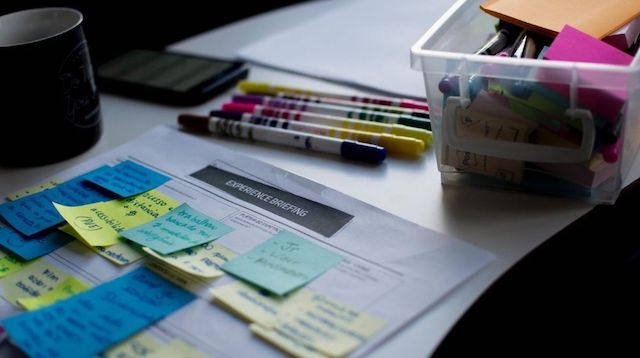 Papers Pens and Notepads on a Desk