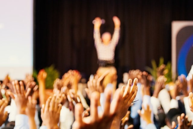 Public Speaker Doing an Exercise with a Crowd