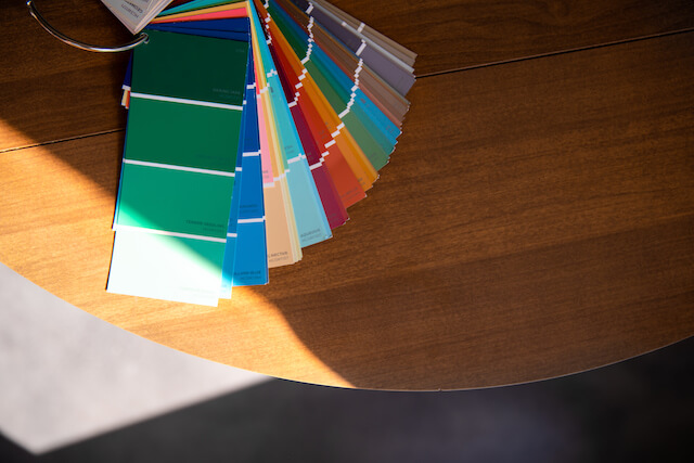 Various color swatches fanned out on a table