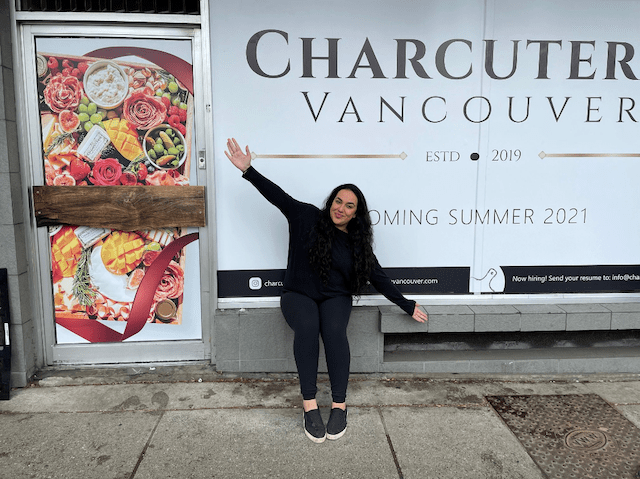 Sadaf posing in front of Charcuterie Vancouver’s storefront