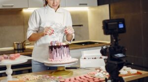 Woman Recording Herself Decorating a Cake