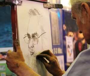 Artist sketching a man’s face