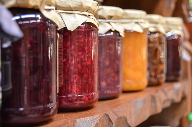 Business Marketing Row of Fruit Preserves on Shelf