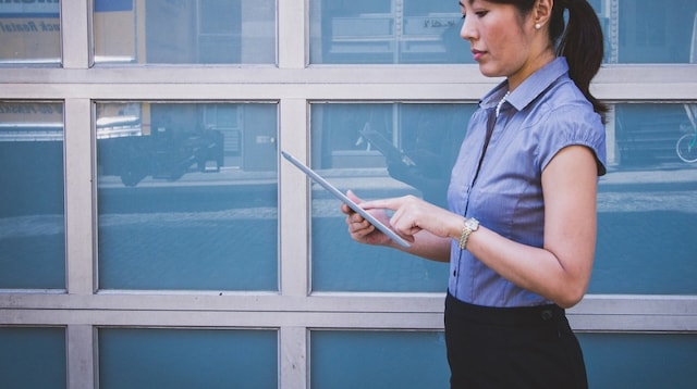 Business Proposal Woman Looking at Tablet