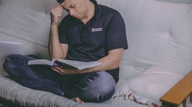 Growth Mindset Man on Couch Reading