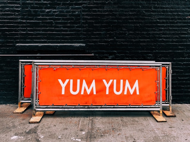 Large orange signs reading yum yum