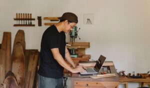 Man in workshop using a laptop