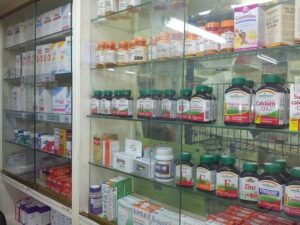 Pharmacy shelves stocked with medicine