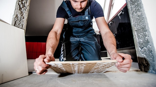 Sell a Business Workman Laying Tile
