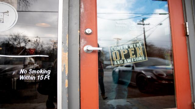 Store front with open sign on door