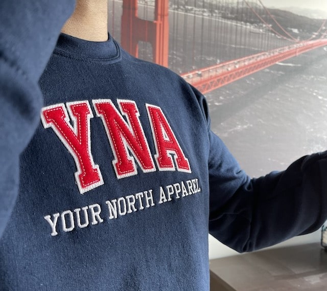 Your North Apparel navy sweatshirt