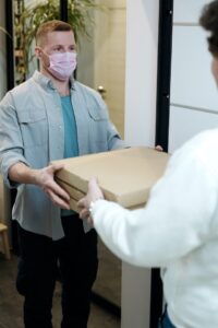 Delivery Person Wearing a Pink Mask