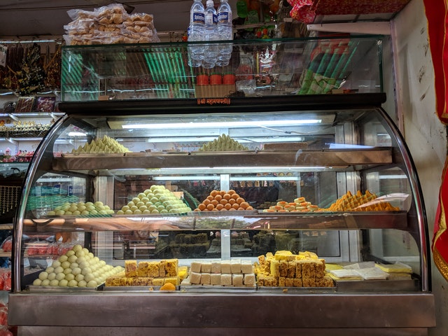 Glass display case full of food