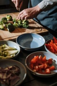 erson Chopping Up Vegetables for Cooking