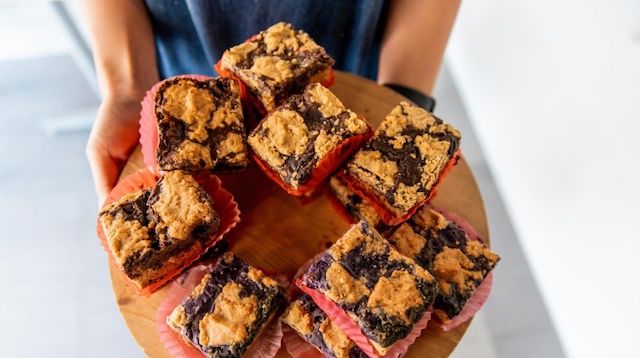 Person Holding Plate of Baked Treats