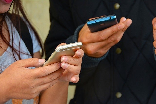 Two People on Their Smartphones