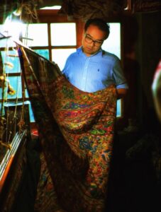 Varun Examining a Kani Shawl