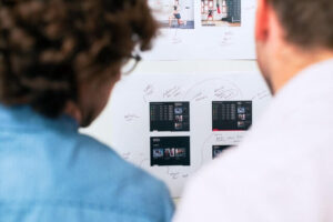 Two people looking at a diagram