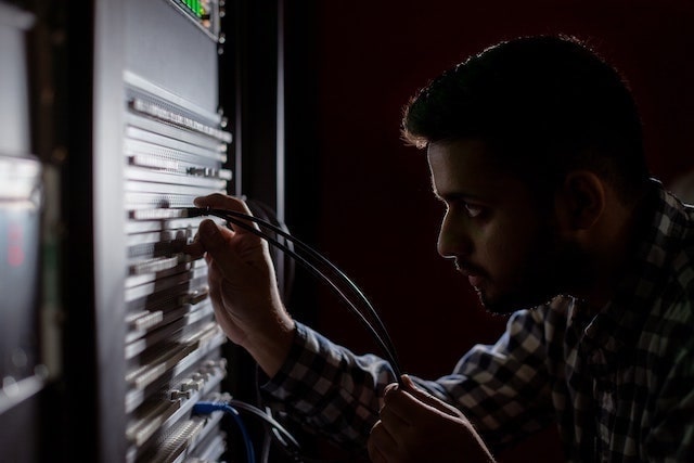 Engineer working with electrical panel