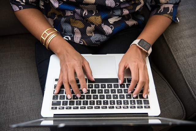 Top Programming Languages Woman Working on Keyboard