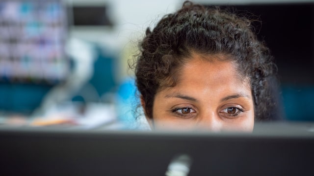 Web developer seen from behind their desk