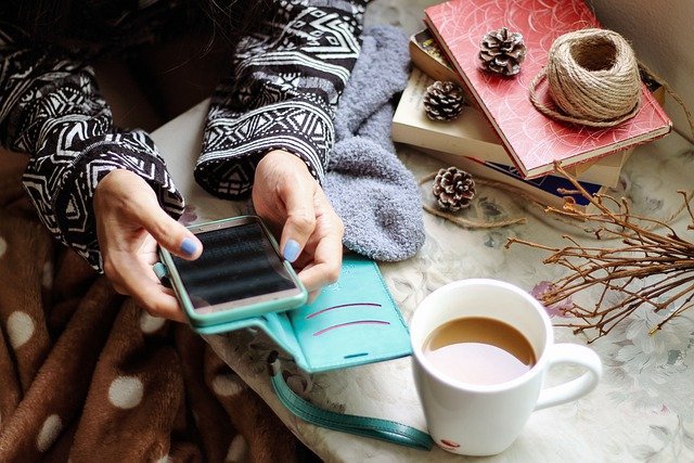 Woman checking social media on her phone