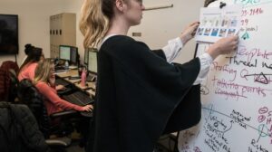 Woman working on a whiteboard