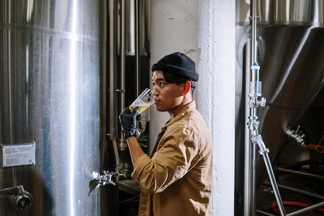 Man tasting beer in a brewery