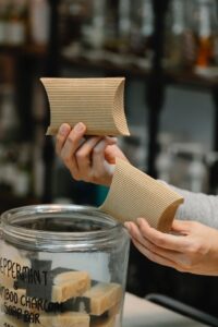 Person holding up bars of handmade soap