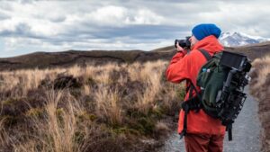 Man outdoors with camera