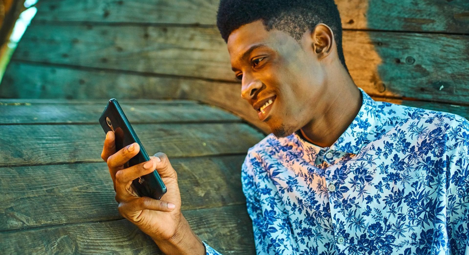 A man easily reading his phone screen.