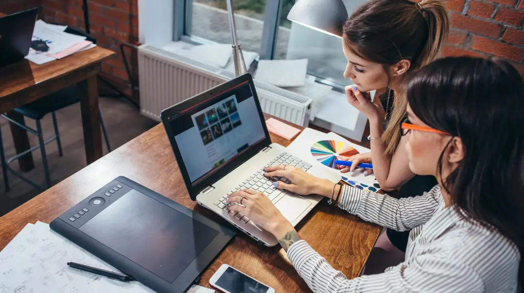 Two colleagues redesigning a website