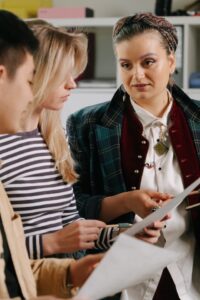 Woman talking to two people