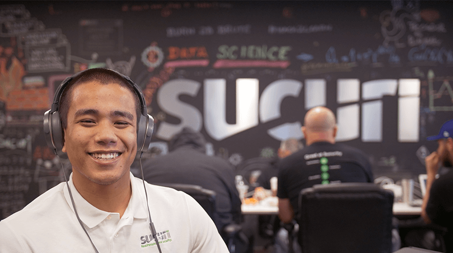 Smiling Sucuri representative in the Sucuri offices