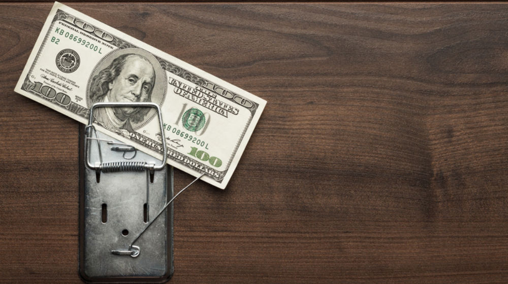 mousetrap with money in it to illustrate sabotaging web project estimates
