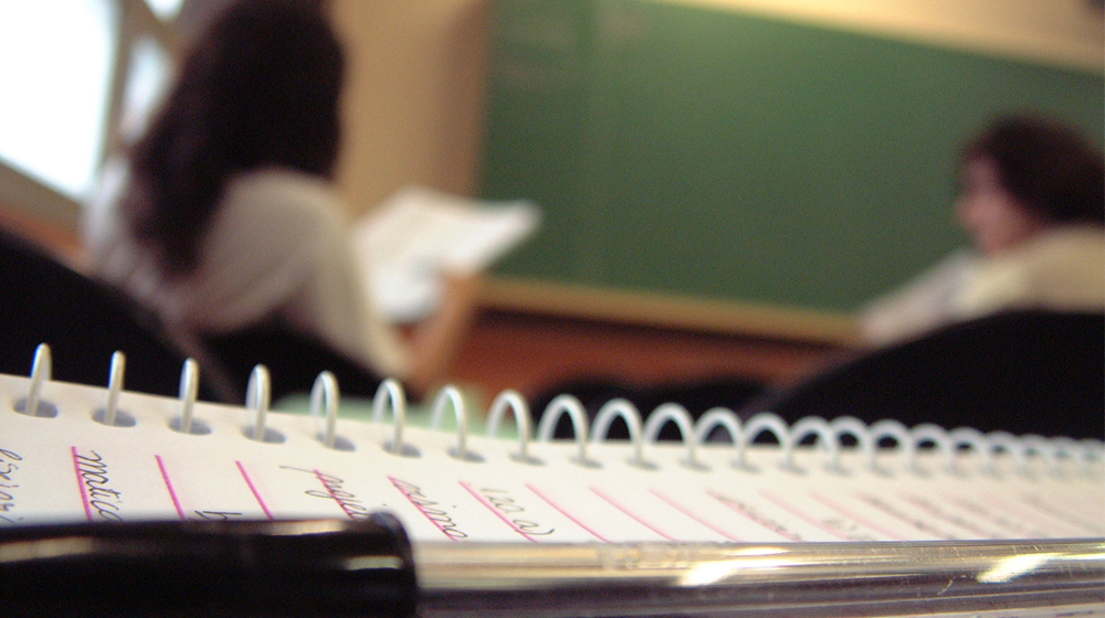 Notebook in classroom to represent educating web design clients