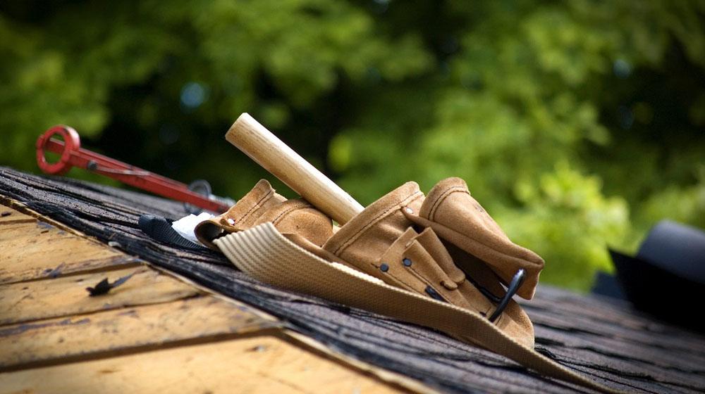 tool belt on roof to represent property services industry
