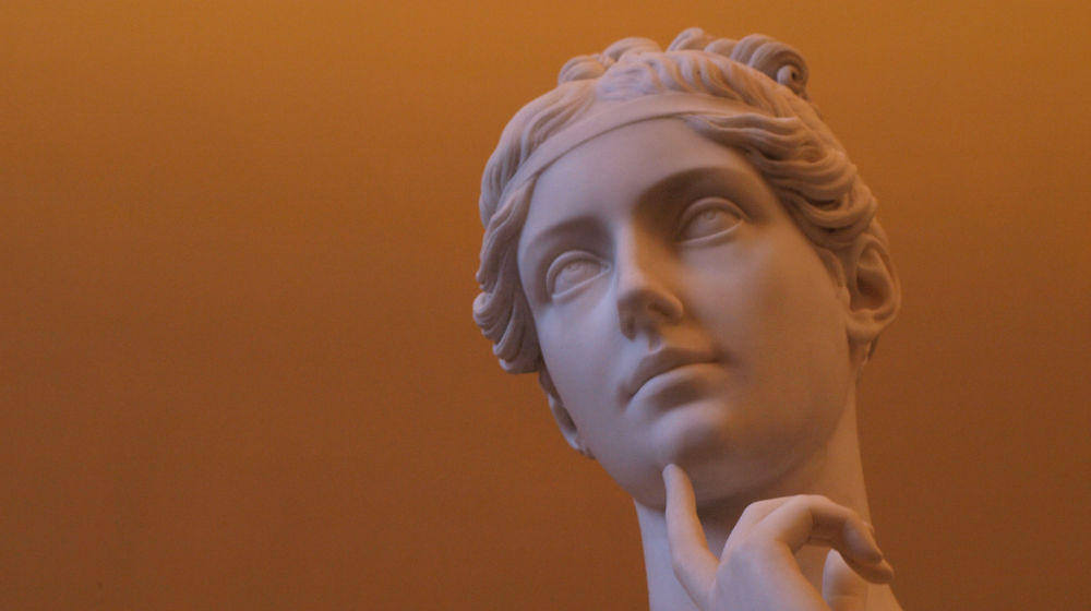 statue of greek woman thinking to represent truth or consequences associated with changing your business name