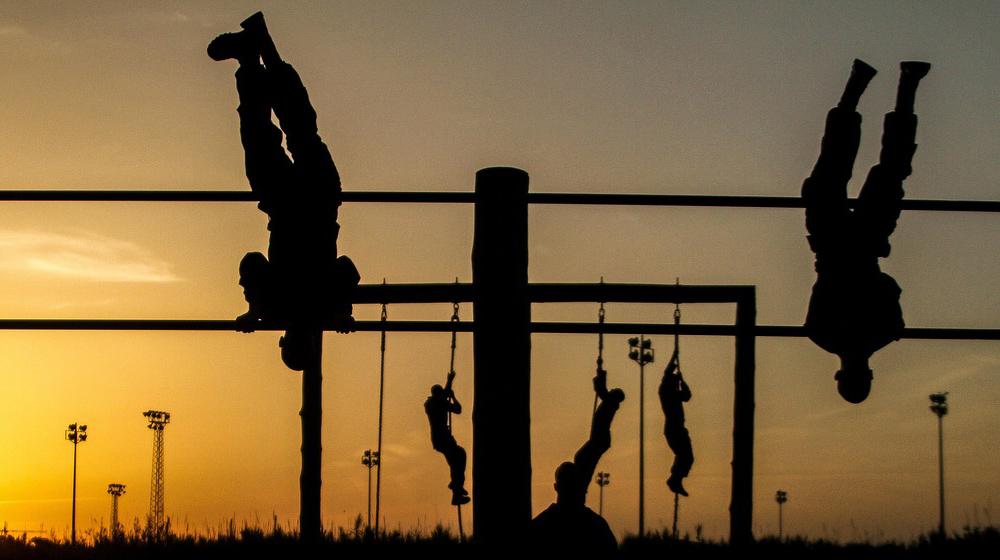 silhouettes of people on obstacle course to represent being a more efficient blogger