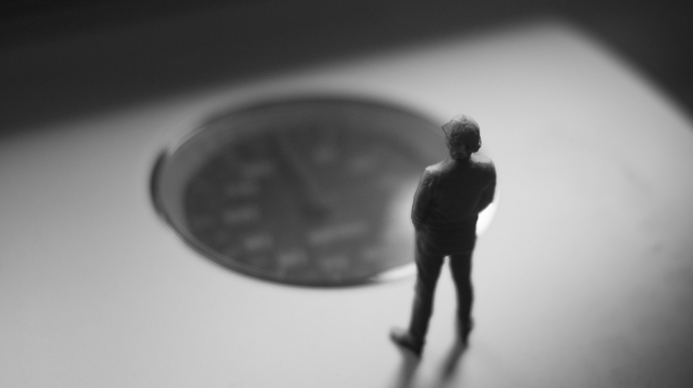 miniature person on scale