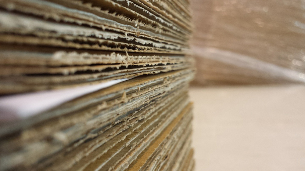 stack of cardboard shipping boxes to represent online shipping tips