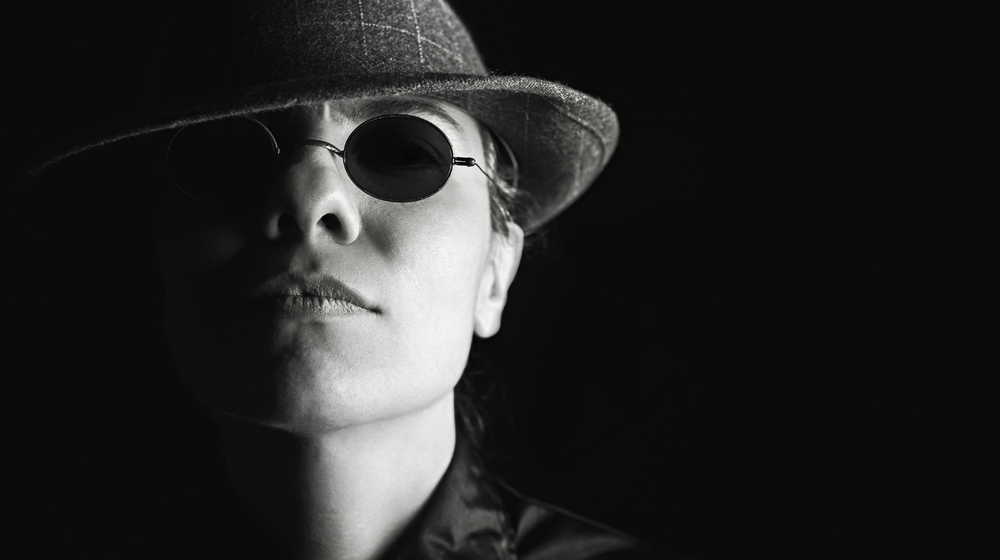 woman in dark glasses to represent busting myths about using stock photos